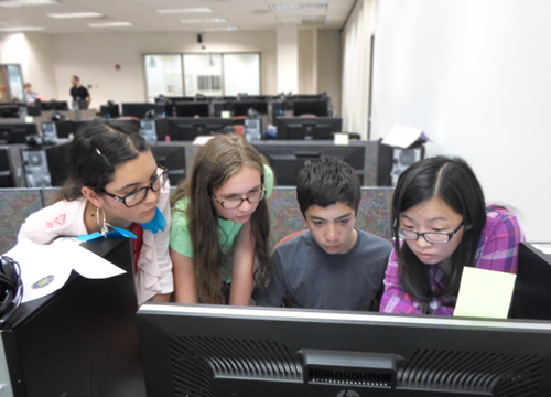 A team tackles “The Pineview Reservoir Challenge” with the help of a mentor well-versed in Python (far right).